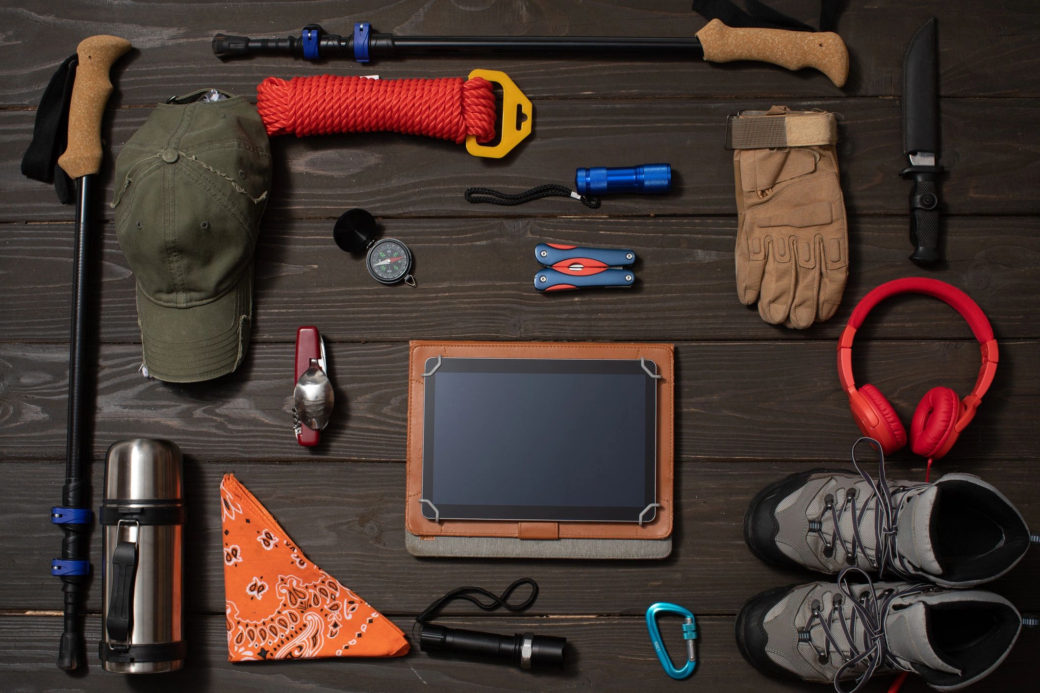 Adventure gear flat lay with boots and accessories