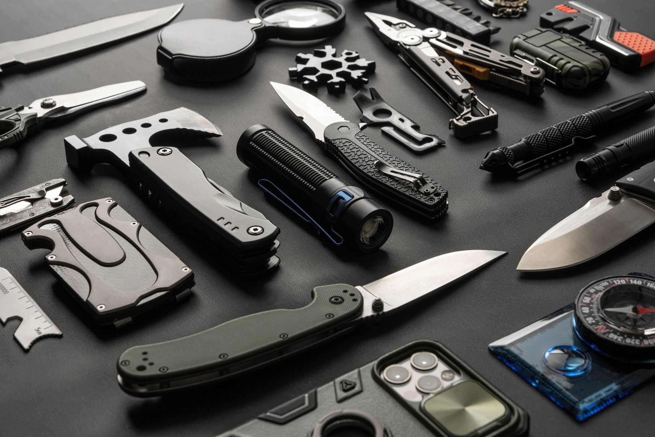 Everyday carry gear laid out on a table