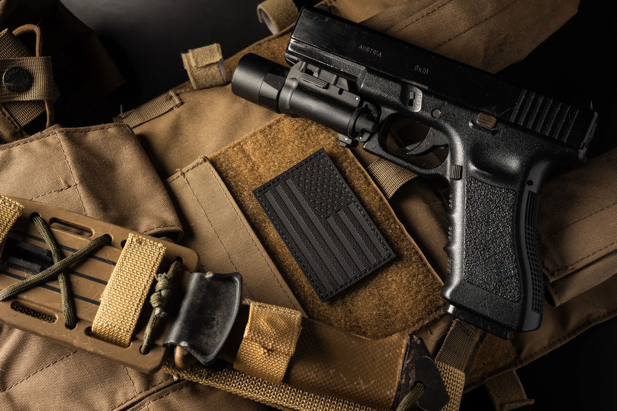 Flat lay of tactical gear with a morale patch